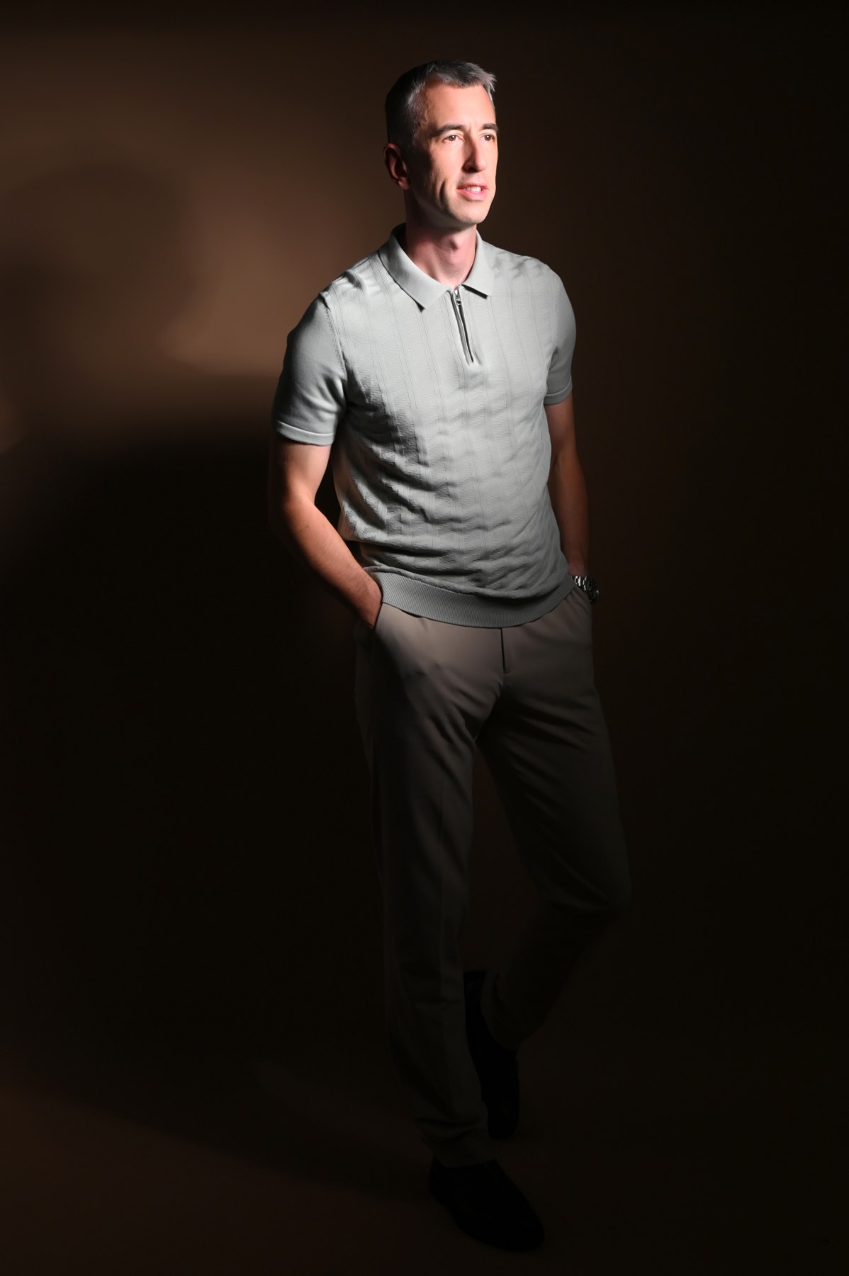Portrait of Theo Grange in a tailored evening look